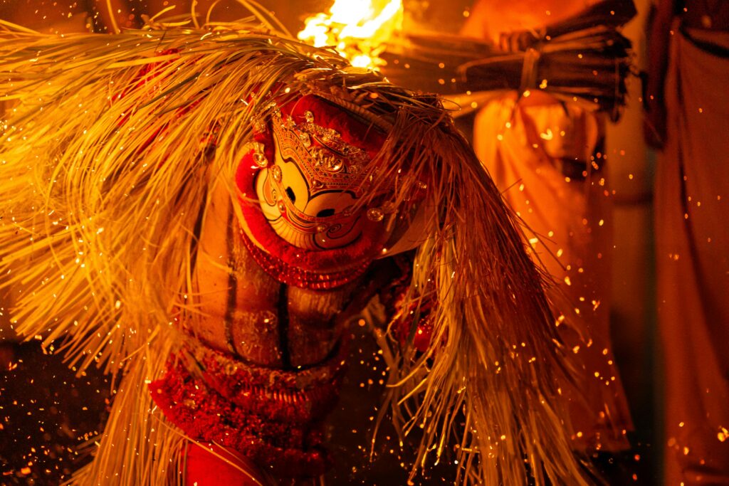Thrilling Theyyam performance captures vibrant cultural traditions in Kannur, India.